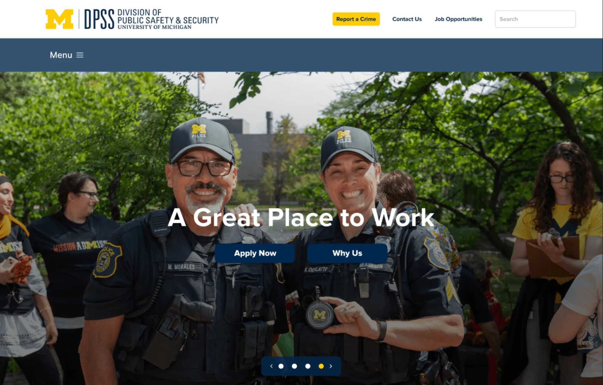 Final homepage on desktop: the DPSS header and menu above a full-width photo of two smiling officers with the headline “A Great Place to Work” and Apply Now and Why Us buttons.